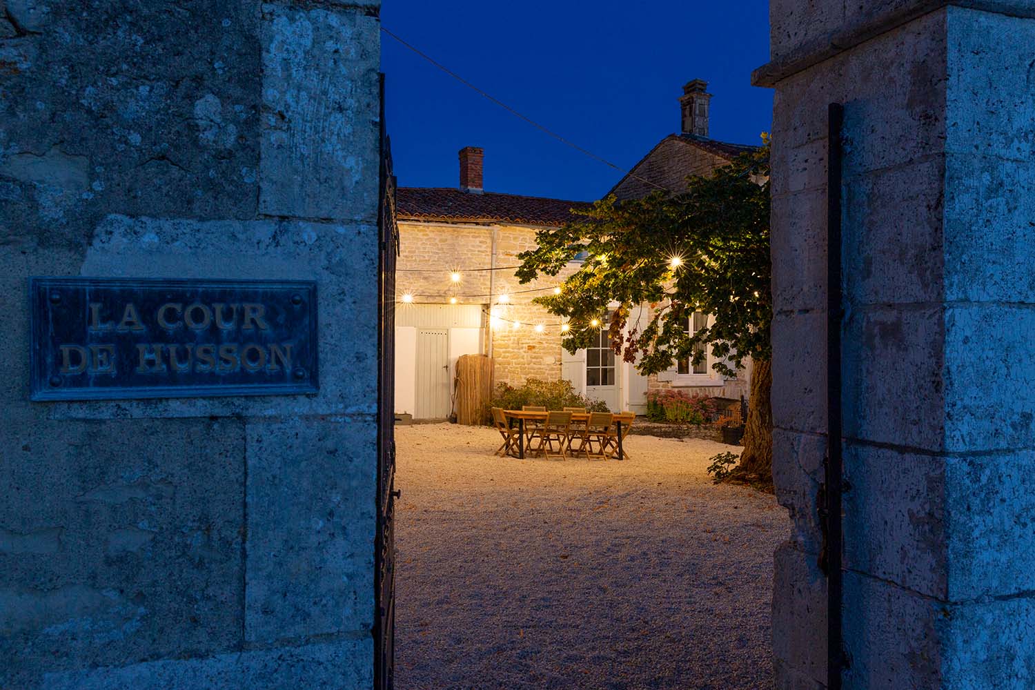 Dusk in the peaceful courtyard of La Cour de Husson
